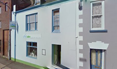 The Chic Salon shopfront on Providence St in St Helier, with its green signage and window display